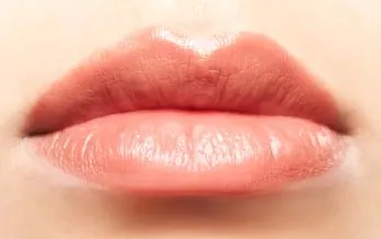 Close-up of an unbroken lip with no visible mark.